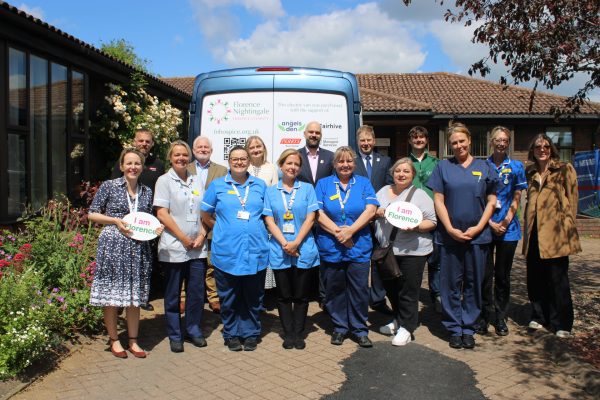 Nurses and donors standing next to the new electric van